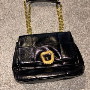 Elegant Black Leather Bag with Gold Chain